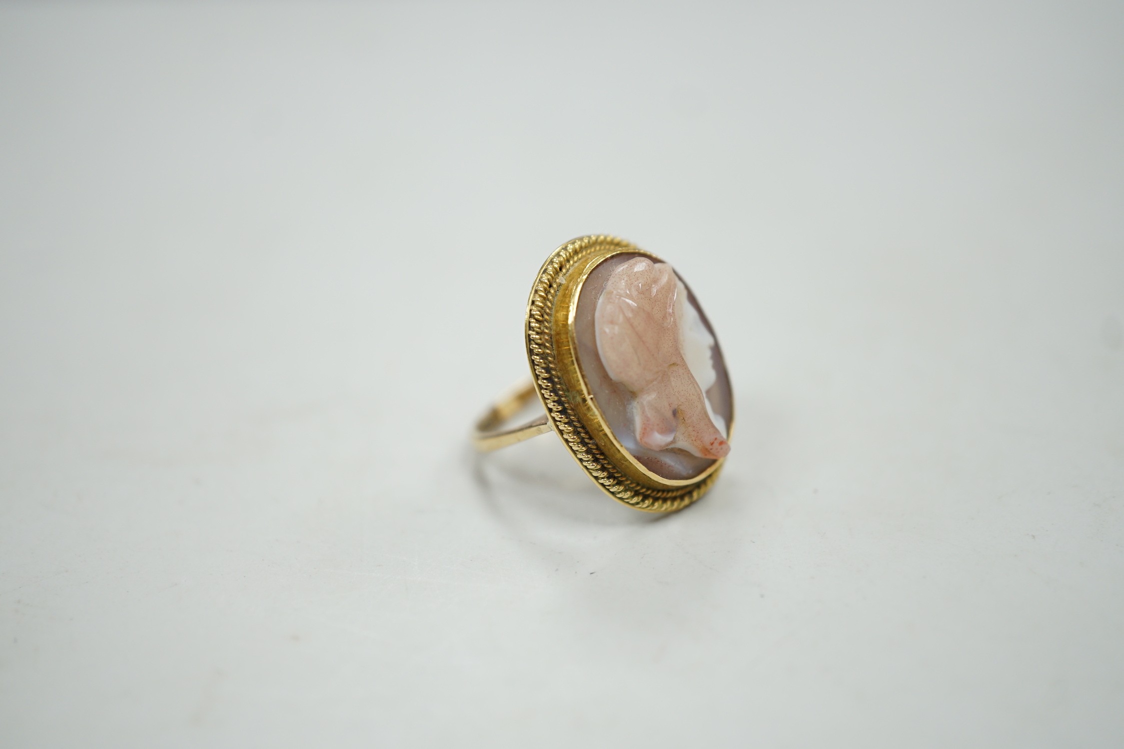 A modern 9ct gold and hardstone cameo ring, carved with the bust of a lady to sinister, size L, gross weight 4.9 grams.